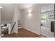 Open hallway leading to bedroom with hardwood flooring and modern lighting at 302 Rutherglen Dr, Cary, NC 27511