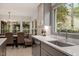 Eat-in kitchen with large windows, stainless appliances, and cozy bench seating at 302 Rutherglen Dr, Cary, NC 27511