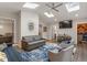 Open living room featuring skylights, hardwood floors, and a wet bar at 302 Rutherglen Dr, Cary, NC 27511