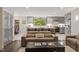 Cozy living room seamlessly connected to the kitchen, creating a warm and inviting space at 302 Rutherglen Dr, Cary, NC 27511