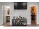 Stylish living room with display shelf, minibar, and views to a bathroom at 302 Rutherglen Dr, Cary, NC 27511
