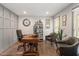Well-lit home office featuring a wooden desk, comfortable chairs, and stylish decor at 302 Rutherglen Dr, Cary, NC 27511