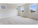Spacious carpeted bedroom with large windows offering plenty of natural light at 304 Catheys Creek Cir, Wendell, NC 27591