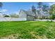 Expansive backyard with lush green lawn and privacy fence at 321 Third Ave, Knightdale, NC 27545