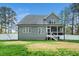 Spacious backyard featuring a well-maintained lawn and a privacy fence at 321 Third Ave, Knightdale, NC 27545
