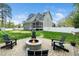 Beautiful backyard with fire pit and a view of the home's exterior at 321 Third Ave, Knightdale, NC 27545