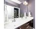 Bathroom featuring a double sink vanity and a decorative plant at 321 Third Ave, Knightdale, NC 27545