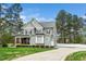 Attractive home showcasing well-maintained landscaping, neutral siding, and a private driveway at 321 Third Ave, Knightdale, NC 27545