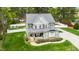 Beautiful two-story home with a welcoming front porch, manicured landscaping, and tasteful design elements at 321 Third Ave, Knightdale, NC 27545