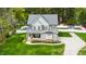 Inviting two-story home featuring a covered front porch, manicured landscaping, and a charming color palette at 321 Third Ave, Knightdale, NC 27545