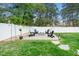 Backyard fire pit with Adirondack chairs, perfect for cozy evenings at 321 Third Ave, Knightdale, NC 27545