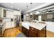 Spacious kitchen with island, farmhouse sink, stainless appliances, and an open view to the living room at 321 Third Ave, Knightdale, NC 27545
