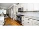 Bright kitchen with stainless steel appliances, granite countertops, and a classic subway tile backsplash at 321 Third Ave, Knightdale, NC 27545