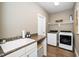 Well-equipped laundry room with modern appliances and ample counter space at 321 Third Ave, Knightdale, NC 27545