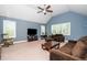 Spacious living room featuring a vaulted ceiling, large windows, and a comfortable seating area at 321 Third Ave, Knightdale, NC 27545