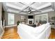 Cozy living room with a fireplace and coffered ceilings, perfect for gatherings at 321 Third Ave, Knightdale, NC 27545