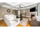 Cozy living room with a fireplace and coffered ceilings, perfect for gatherings at 321 Third Ave, Knightdale, NC 27545