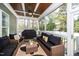 Inviting screened porch with comfortable seating and outdoor grill at 321 Third Ave, Knightdale, NC 27545