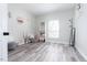 Bright bedroom featuring luxury vinyl floors, white walls, and lots of space at 323 W 5Th St, Burlington, NC 27215