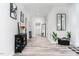 Inviting hallway featuring neutral paint, modern decor, and stylish flooring leading to other rooms at 323 W 5Th St, Burlington, NC 27215