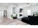 Bright living room with a modern fireplace, stylish furnishings, and lots of natural light at 323 W 5Th St, Burlington, NC 27215