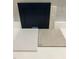 Select a Luxury Vinyl floor tile and backsplash to complement your home with these navy cabinets at 324 White Oak Garden Way # 219, Garner, NC 27529
