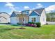 Landscaped front yard of a charming home at 358 Ashpole Trl, Clayton, NC 27520