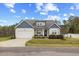 Charming home with a well-manicured front yard and welcoming entrance at 358 Ashpole Trl, Clayton, NC 27520