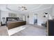 Spacious main bedroom with a tray ceiling, neutral paint, and a ceiling fan at 358 Ashpole Trl, Clayton, NC 27520