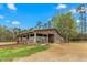 Rustic barn featuring dirt lot and surrounding trees at 3880 L Lawrence Trl, Graham, NC 27253