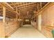 Interior of barn featuring natural wood and open stalls at 3880 L Lawrence Trl, Graham, NC 27253