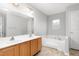 Bathroom with dual sink vanity and jacuzzi tub at 3880 L Lawrence Trl, Graham, NC 27253