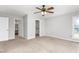 Bedroom with neutral walls and carpet features a ceiling fan and a double window at 3880 L Lawrence Trl, Graham, NC 27253