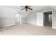 Bonus room featuring ceiling fan, neutral walls and an open doorway at 3880 L Lawrence Trl, Graham, NC 27253