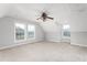 Spacious bonus room featuring neutral walls and two windows at 3880 L Lawrence Trl, Graham, NC 27253