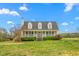 Charming home with a welcoming front porch and dormer windows at 3880 L Lawrence Trl, Graham, NC 27253