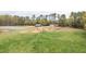 Horse facilities including a horse barn, horse riding area, and fenced pasture land at 3880 L Lawrence Trl, Graham, NC 27253