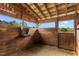 Rustic horse stall made of wood, showcasing a beautiful view of the outdoors at 3880 L Lawrence Trl, Graham, NC 27253