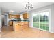 Eat-in kitchen featuring a breakfast bar and sliding glass door to the backyard at 3880 L Lawrence Trl, Graham, NC 27253