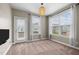 Cozy dining area with large windows offering scenic views and natural light at 3914 Glorybower Way, Apex, NC 27502