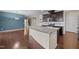 Spacious kitchen featuring granite counters, stainless steel appliances, and stylish dark cabinets at 3914 Glorybower Way, Apex, NC 27502