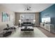 Cozy living room with modern decor, comfortable seating, a ceiling fan, and natural light at 3914 Glorybower Way, Apex, NC 27502