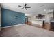 Open-concept living space with kitchen featuring granite counters and stainless steel appliances at 3914 Glorybower Way, Apex, NC 27502