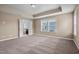Bright bedroom with trey ceiling and natural light, attached ensuite with walk-in shower and vanity at 3914 Glorybower Way, Apex, NC 27502