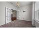 Versatile room with double doors, chandelier, and window light, suitable for an office or guest room at 3914 Glorybower Way, Apex, NC 27502