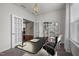 Bright office space with french doors, a modern desk, and views of the backyard at 3914 Glorybower Way, Apex, NC 27502