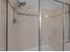 Walk-in tile shower with built-in bench and showerhead at 3914 Glorybower Way, Apex, NC 27502
