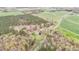 Aerial view of a large lot with expansive pastures and a tree lined perimeter providing privacy at 4018 Moon Lindley Rd, Snow Camp, NC 27349