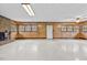 Large basement area with wood paneling, multiple windows and easy access to outdoors at 4018 Moon Lindley Rd, Snow Camp, NC 27349
