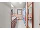 Bathroom with dual sinks, vintage pink tiling, and a seashell curtain at 4018 Moon Lindley Rd, Snow Camp, NC 27349